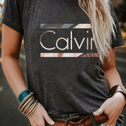 1pc Calvin Women's Graphic Tee - Soft Polyester Spandex Blend, Casual Crew Neck Short Sleeve Top in Black with Stylish Letter Print, Comfortable Casual Attire, Everyday Apparel | Trendy Casual Style | Stretchable Top
