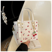 Women's Cherry Pattern Bucket Bag with Detachable Charm, Zipper Closure, Large Capacity Fashionable Crossbody Bag in Red/White, Perfect for Shopping, Commuting, or Gift Giving, Versatile Crossbody Bag | Playful Cherry Design