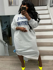 Plus-Size Casual Dress for Women, Featuring a Stylish Printed Color-Blocked Design with a Slit, Resembling a Sweatshirt Dress.