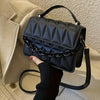 Fashionable Mini Embossed Crossbody Bag for Women - Stylish Pure Black Shoulder Bag with Magnetic Closure.