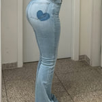 Stylish High-Quality Blue Denim Women's Jeans with Flared Leg Design and Heart-Shaped Patch - Comfortable Stretch Blend for Casual Wear - Long Length, Trendy and Fashionable Fit