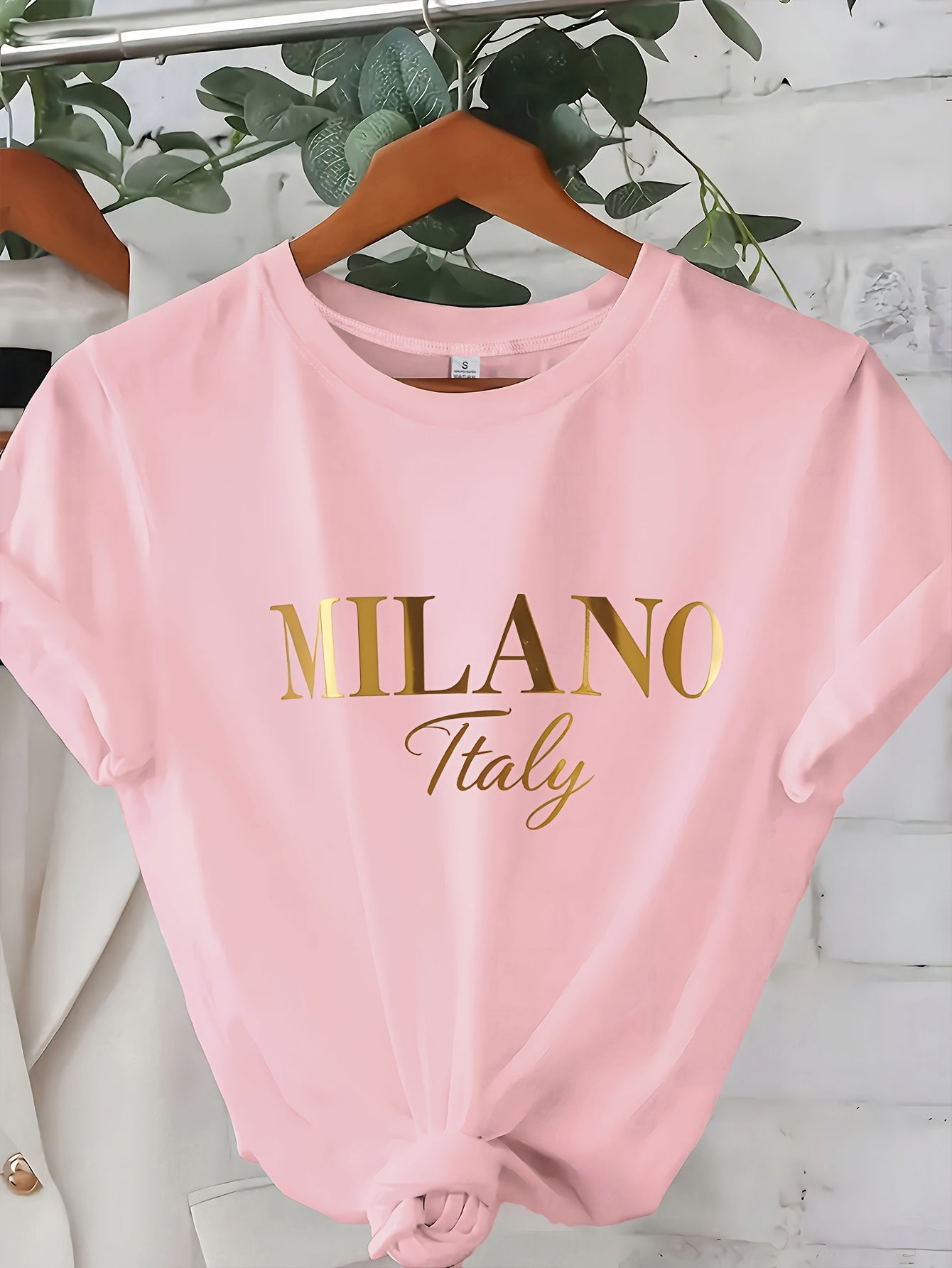 C571 Exuding elegance and modern luxury the design features MILANO in bold shimmering Golden uppercase letters with ITALY elegantly scripted in a smaller lighter font directly beneath all set against a deep black background T