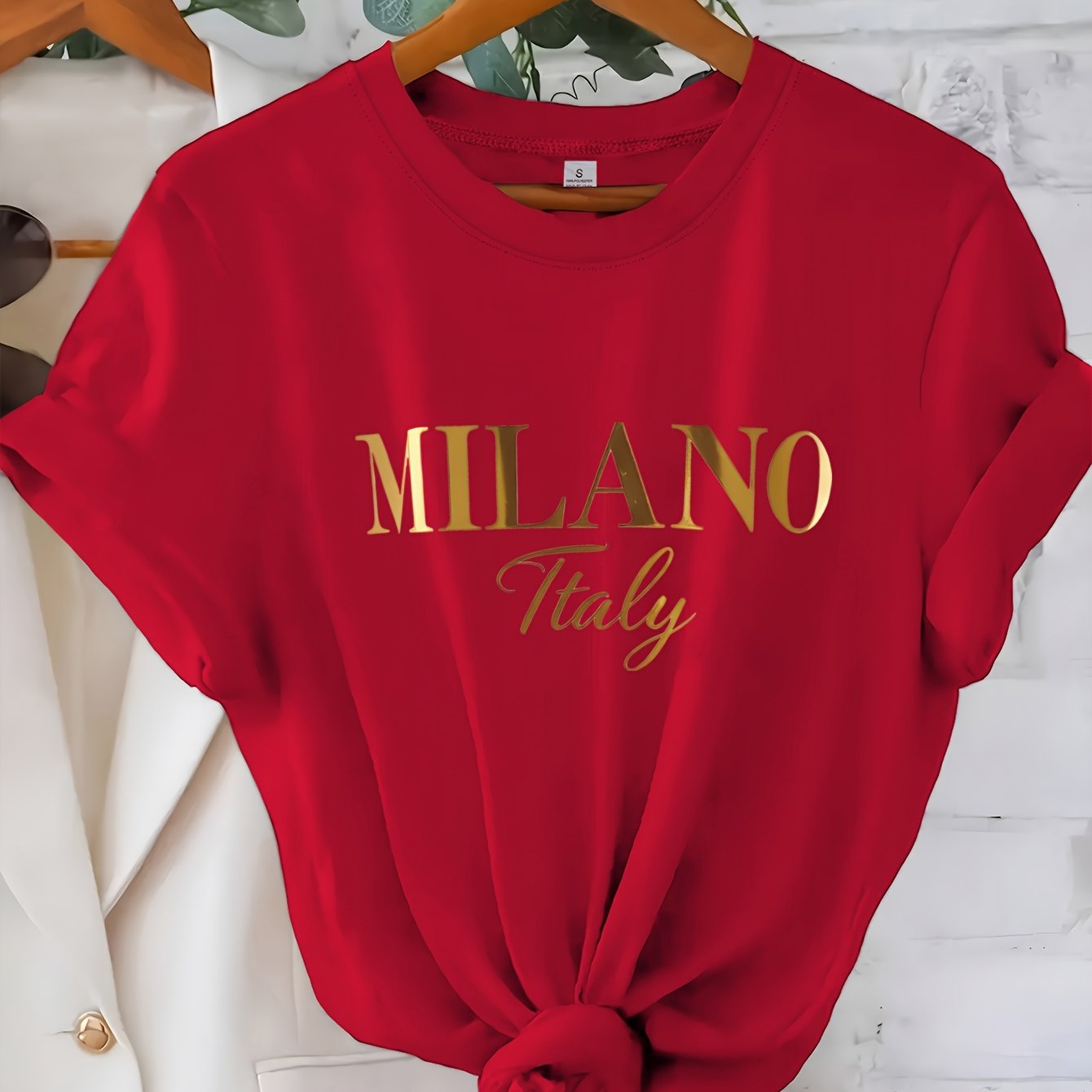 C571 Exuding elegance and modern luxury the design features MILANO in bold shimmering Golden uppercase letters with ITALY elegantly scripted in a smaller lighter font directly beneath all set against a deep black background T