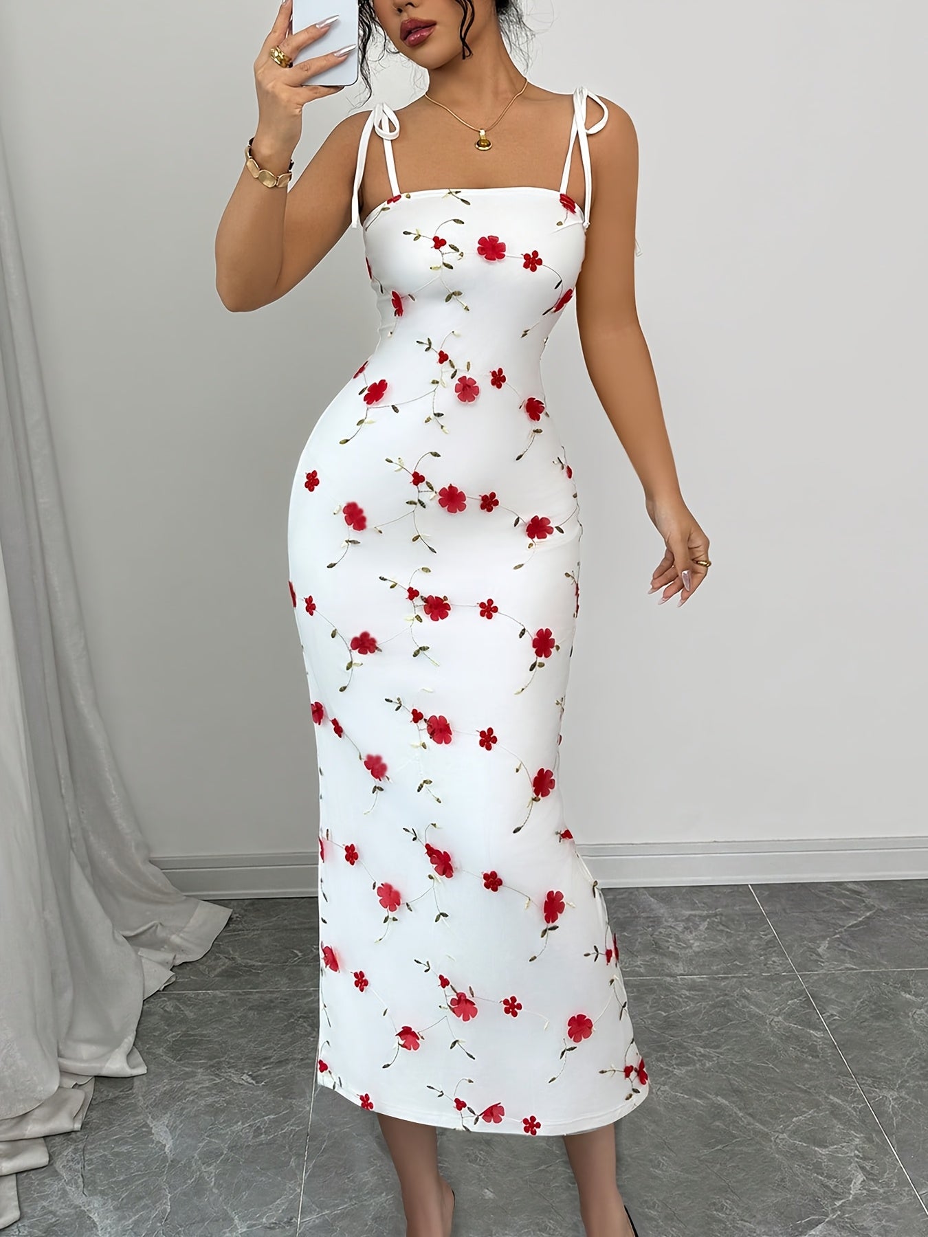 A Simple, Fitted Long Dress with Thin Shoulder Straps And a Waist Belt.