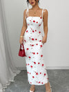A Simple, Fitted Long Dress with Thin Shoulder Straps And a Waist Belt.