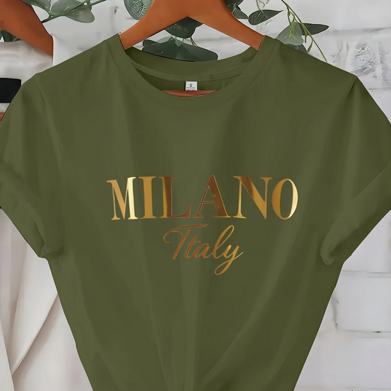 C571 Exuding elegance and modern luxury the design features MILANO in bold shimmering Golden uppercase letters with ITALY elegantly scripted in a smaller lighter font directly beneath all set against a deep black background T