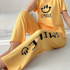 Women's Smiling Face & Letter Print Casual Pajama Set, Short Sleeve Round Neck Top & Pants, Comfortable Relaxed Fit