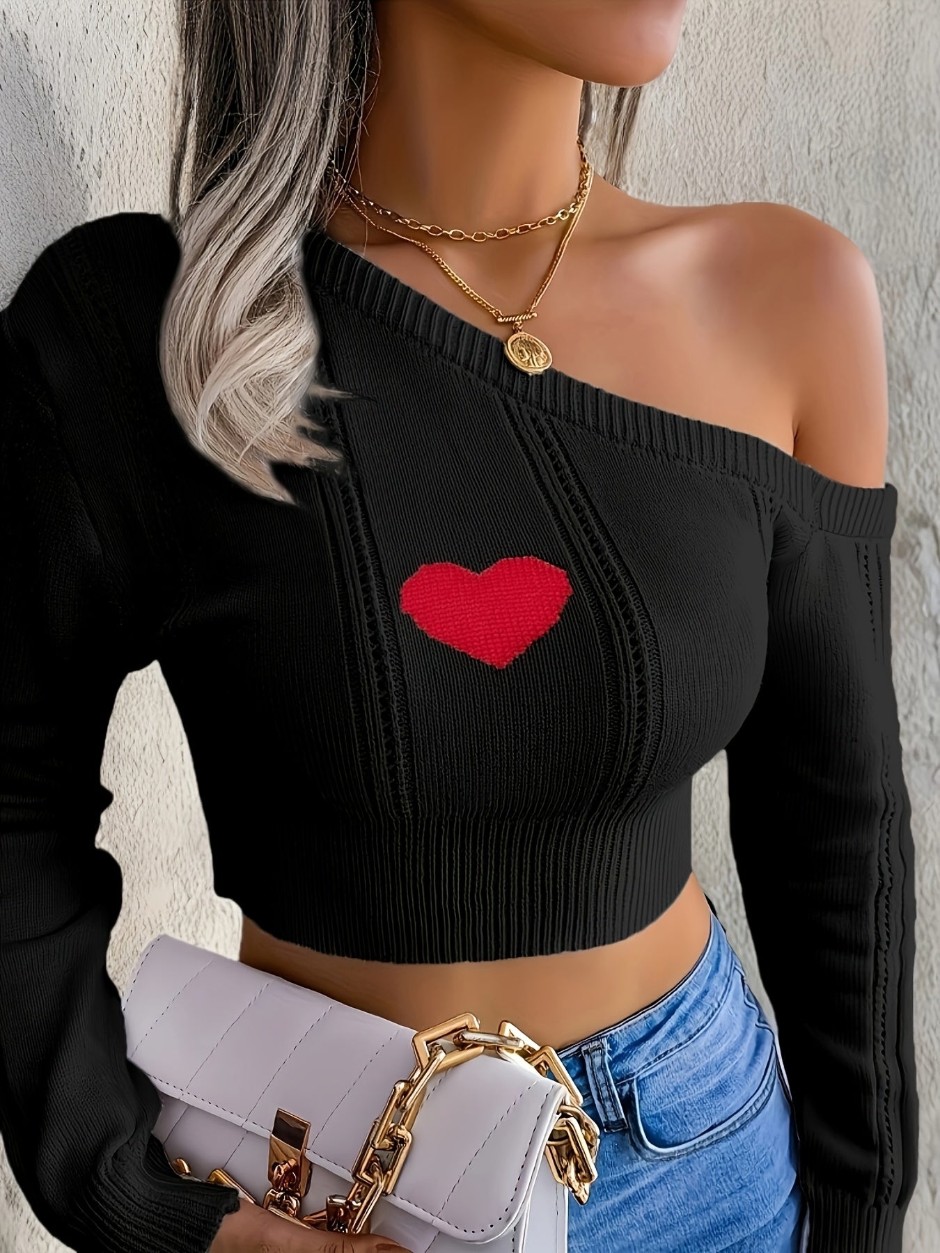A Stylish Sweater with a Heart Design, Featuring an Elegant Off-Shoulder Look And a Fitted Knit Style.