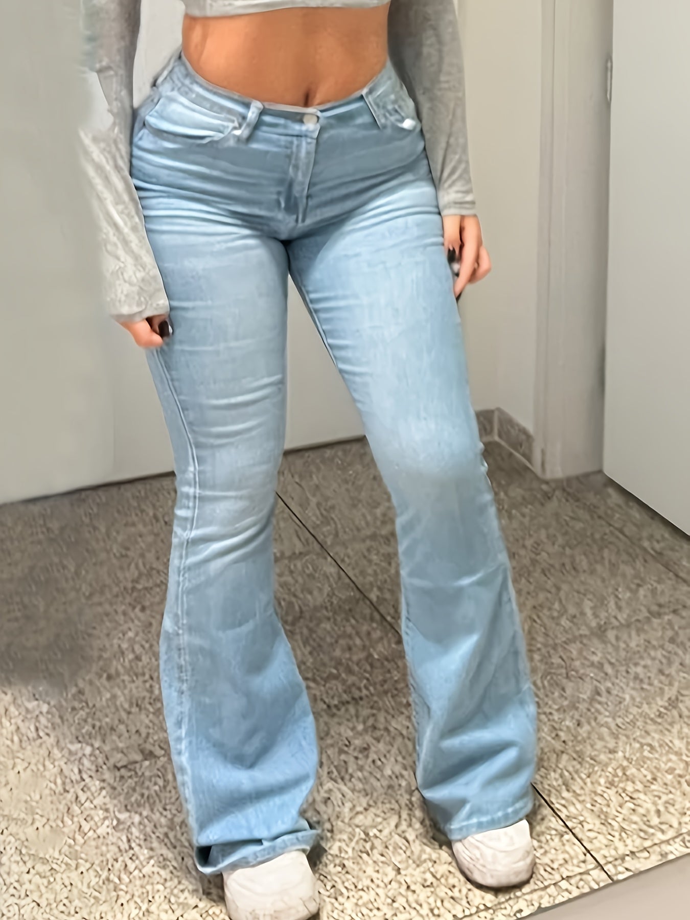 Stylish High-Quality Blue Denim Women's Jeans with Flared Leg Design and Heart-Shaped Patch - Comfortable Stretch Blend for Casual Wear - Long Length, Trendy and Fashionable Fit