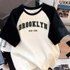 Brooklyn New York" Girls' Short Sleeve T-Shirt - Casual Summer 2025, Loose Fit with Raglan Sleeves, White & Black Color Block Top with Applique Detail, Polyester, Nonchic Style, Summer Top | Trendy Casualwear | Stylish Text D