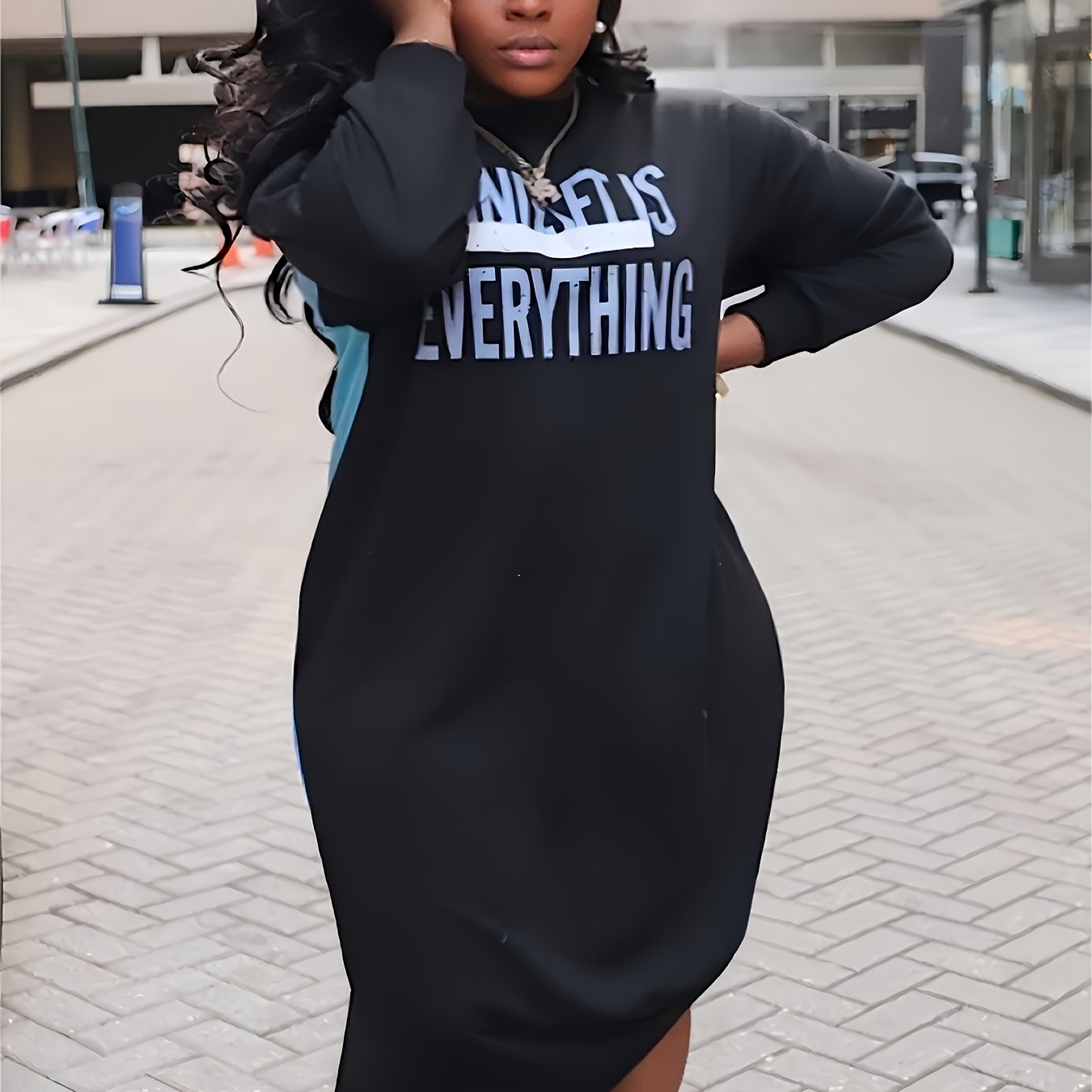Plus-Size Casual Dress for Women, Featuring a Stylish Printed Color-Blocked Design with a Slit, Resembling a Sweatshirt Dress.