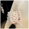 Women's Cherry Pattern Bucket Bag with Detachable Charm, Zipper Closure, Large Capacity Fashionable Crossbody Bag in Red/White, Perfect for Shopping, Commuting, or Gift Giving, Versatile Crossbody Bag | Playful Cherry Design