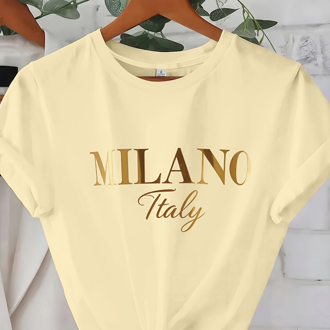 C571 Exuding elegance and modern luxury the design features MILANO in bold shimmering Golden uppercase letters with ITALY elegantly scripted in a smaller lighter font directly beneath all set against a deep black background T