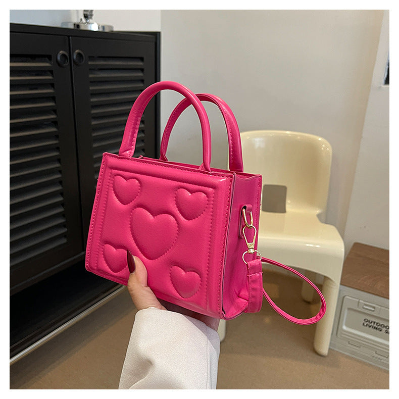 1pc Women’s Stylish Solid Color Handbag with Detachable Strap – Heart Pattern Design, Perfect for Valentine’s Day Gift, Available in Magenta, White, Black, Green, Yellow
