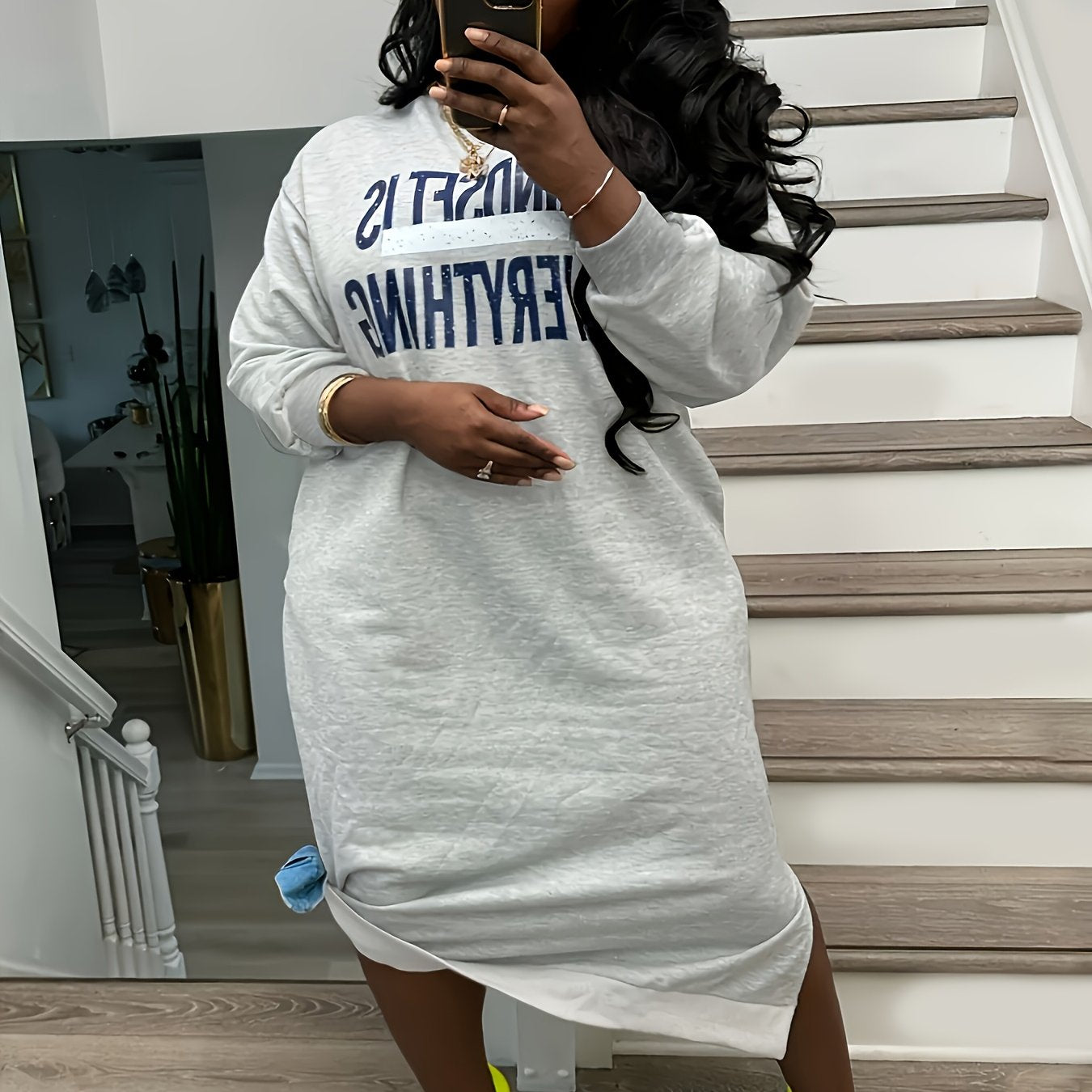 Plus-Size Casual Dress for Women, Featuring a Stylish Printed Color-Blocked Design with a Slit, Resembling a Sweatshirt Dress.
