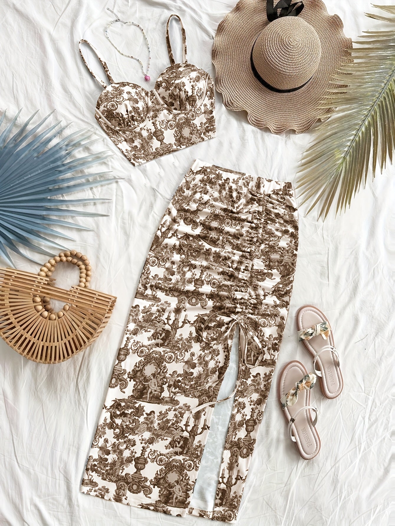 Spring and summer new arrivals: Beach vacation portrait print halter top and side slit skirt.