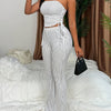 A Two-Piece Set Featuring a Textured Wrinkled Fabric Strapless Top with Drawstring And Fitted Flared Long Pants.
