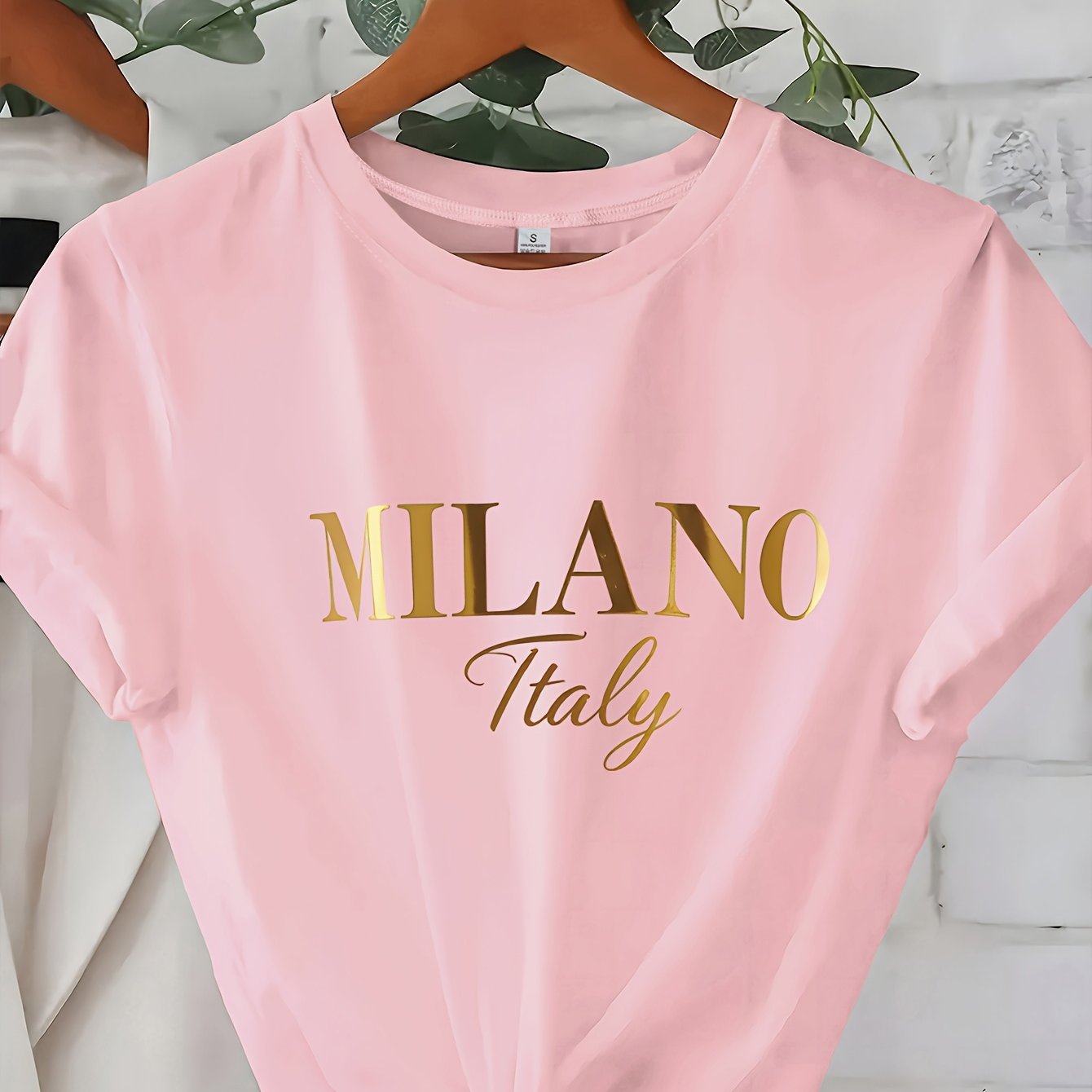 C571 Exuding elegance and modern luxury the design features MILANO in bold shimmering Golden uppercase letters with ITALY elegantly scripted in a smaller lighter font directly beneath all set against a deep black background T