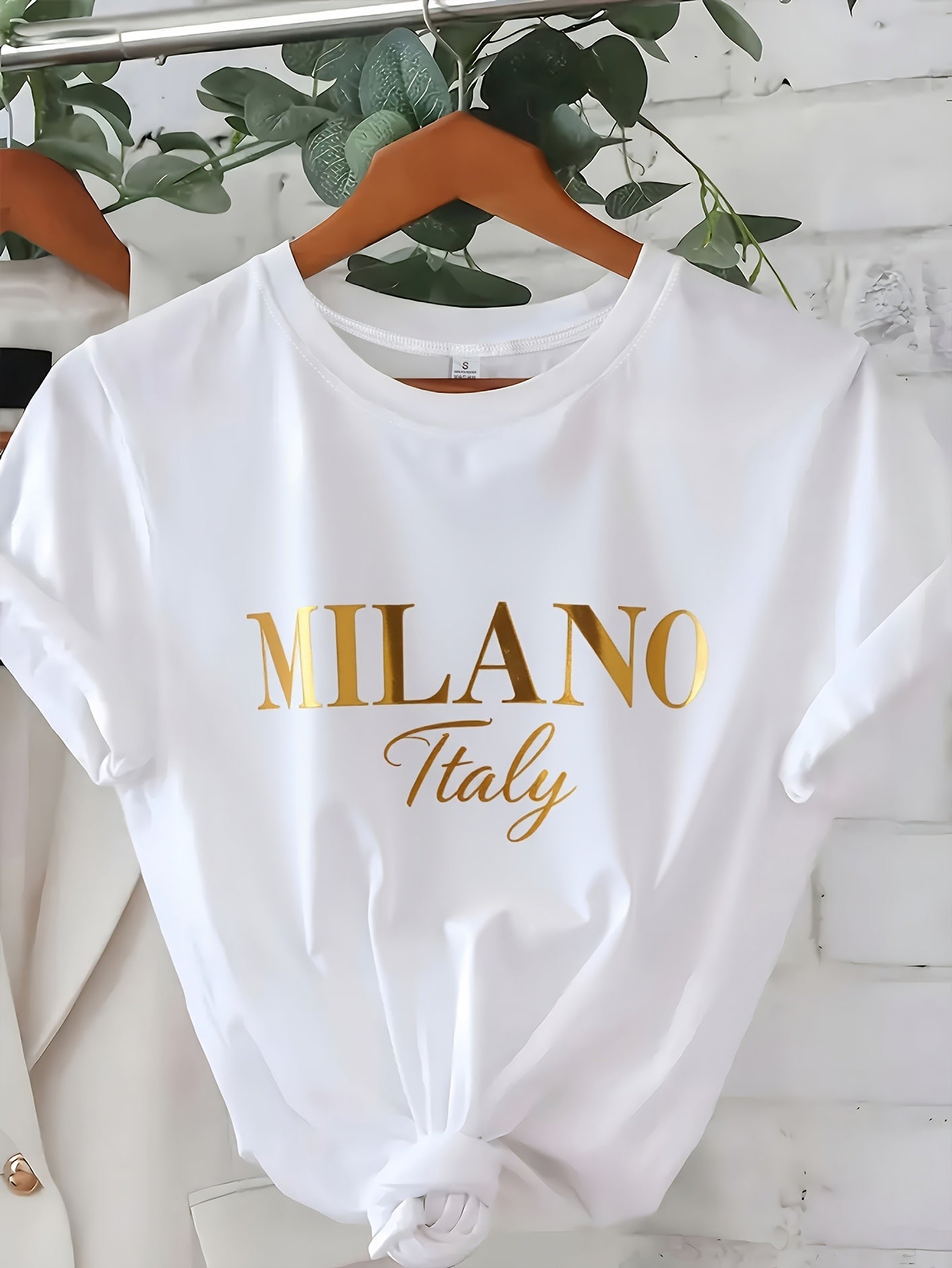 C571 Exuding elegance and modern luxury the design features MILANO in bold shimmering Golden uppercase letters with ITALY elegantly scripted in a smaller lighter font directly beneath all set against a deep black background T
