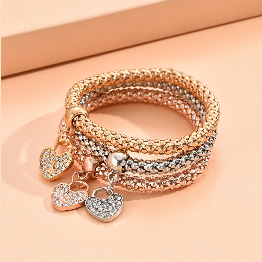 A European and American-border alloy three color set elastic popcorn chain pendant bracelet female