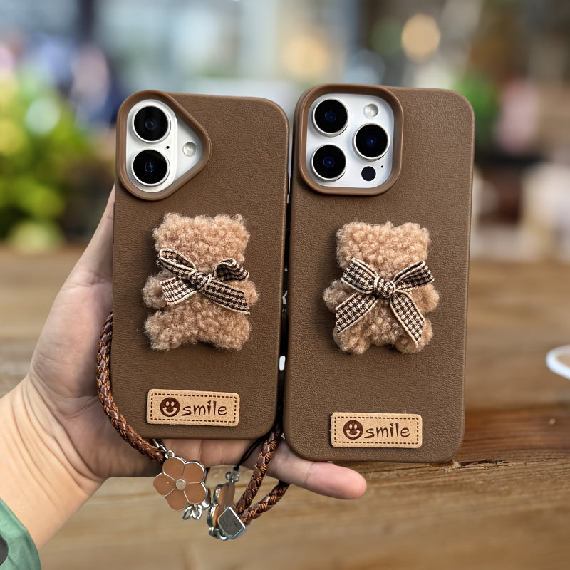 A Single-Pack Plush Teddy Bear Phone Case with a Bow, Available in White And Brown. It Comes with a Wrist Strap And Features a Simple And Elegant Faux Leather Texture That Is Anti-Slip And Fingerprint-Resistant. Made with TPU