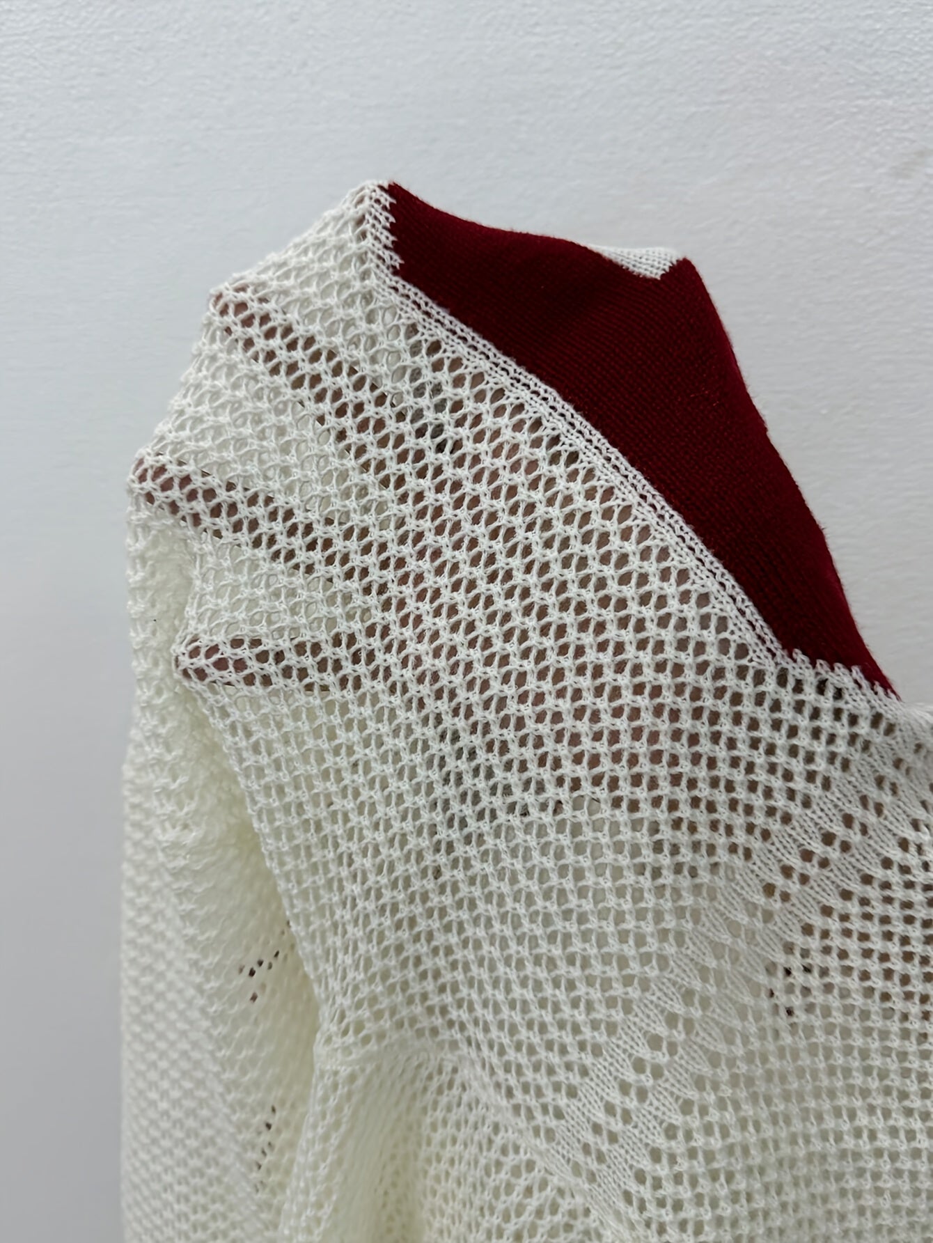 A Oversized Knitted Sweater with Striped And Number Prints, Featuring Long Sleeves.
