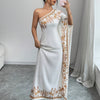 An Elegant Long Dress with an Asymmetrical Floral Print on The Shoulder, Suitable for Formal Occasions.