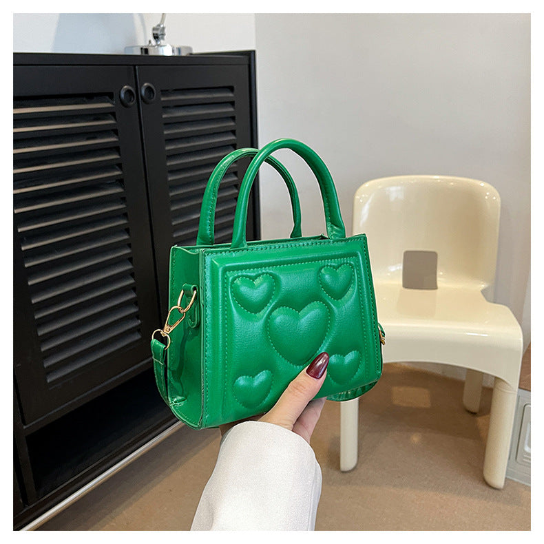 1pc Women’s Stylish Solid Color Handbag with Detachable Strap – Heart Pattern Design, Perfect for Valentine’s Day Gift, Available in Magenta, White, Black, Green, Yellow