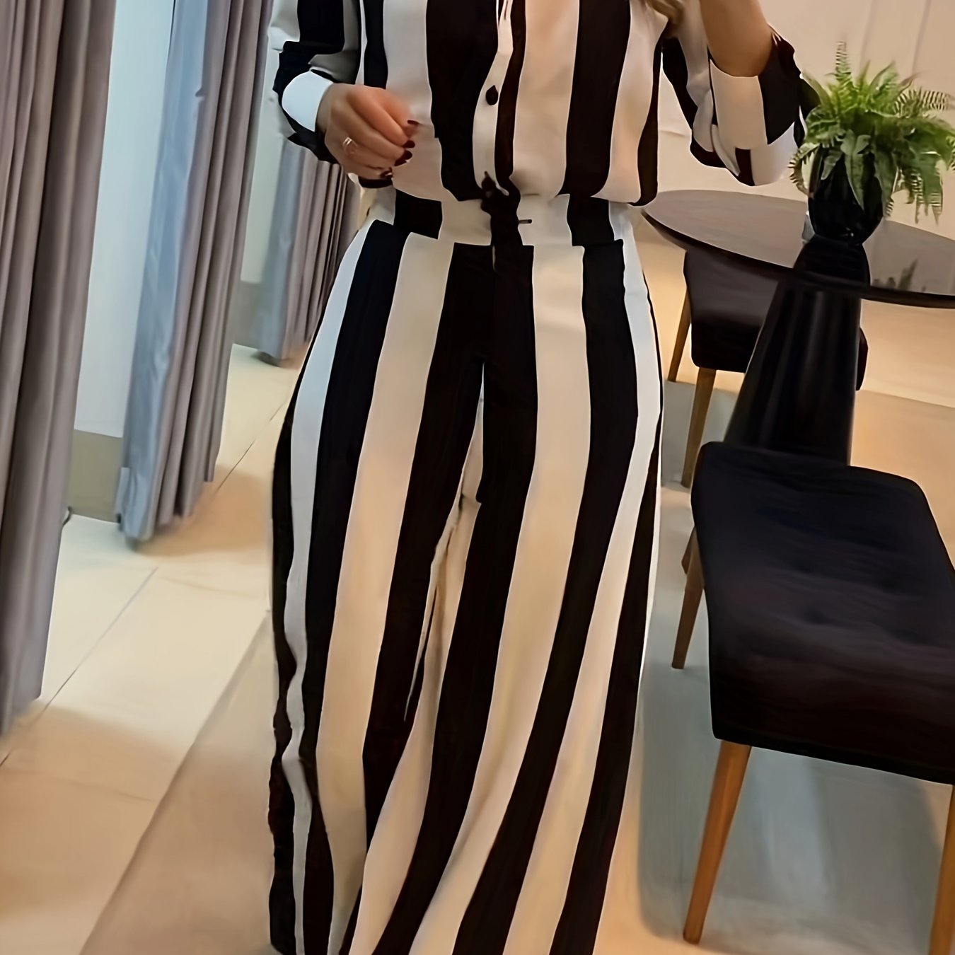 A Two-Piece Set Featuring a Stylish Black And White Striped Shirt with Button Pocket Design And Wide-Leg Pants for Autumn Leisure.