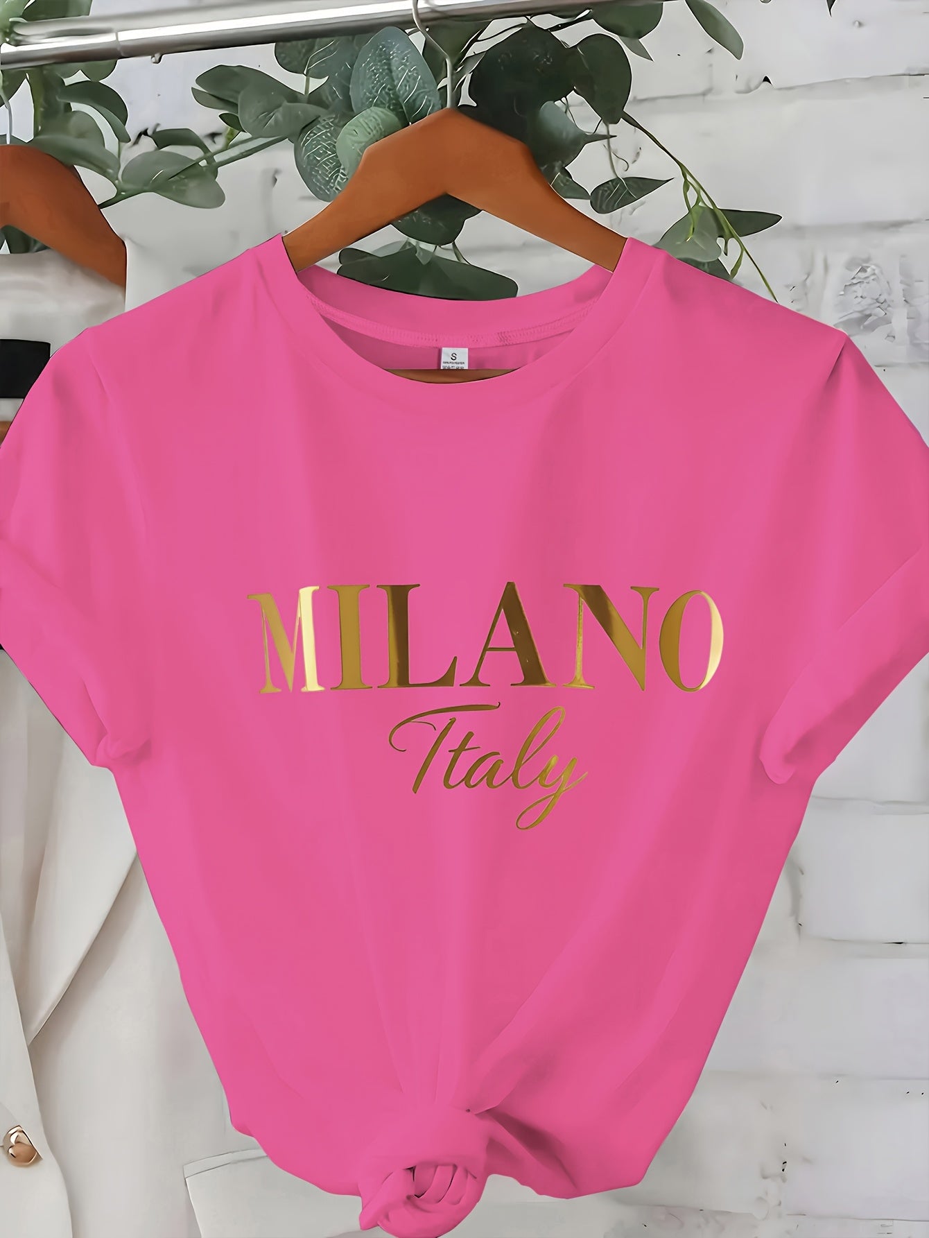 C571 Exuding elegance and modern luxury the design features MILANO in bold shimmering Golden uppercase letters with ITALY elegantly scripted in a smaller lighter font directly beneath all set against a deep black background T