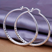 A Pair Of Exquisite Large Circle Earrings, An Elegant Ladies' Accessory In A Luxury Style, Perfect For Women To Wear On A Daily Basis.