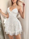 Fashionable Summer White Dress with a Halter Neck And Polka Dots, Featuring Removable Floral Decorations.
