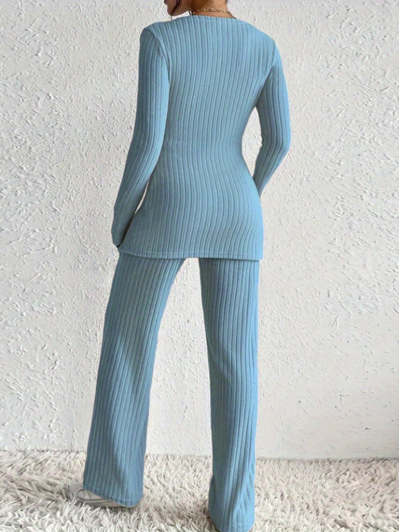2025 Hit A Women'S Suit with an Irregular Design Exuding a High-End Feel. It'S a Two-Piece Set Featuring a Comfortable Long-Sleeved Top Paired with Wide-Leg Pants.