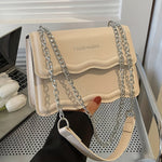 Elegant Mini Messenger Bag for Women: Magnetic Closure, Scallop Design, Chain Strap, Faux Leather Lining, Solid Color