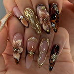 24pcs set of almond-shaped false nails with 3D three-dimensional wave texture and pure desire pearl flowers and sparkling rhinestones suitable for all women and girls. The box comes with nail files and jelly glue for easy app