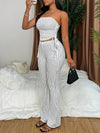 A Two-Piece Set Featuring a Textured Wrinkled Fabric Strapless Top with Drawstring And Fitted Flared Long Pants.