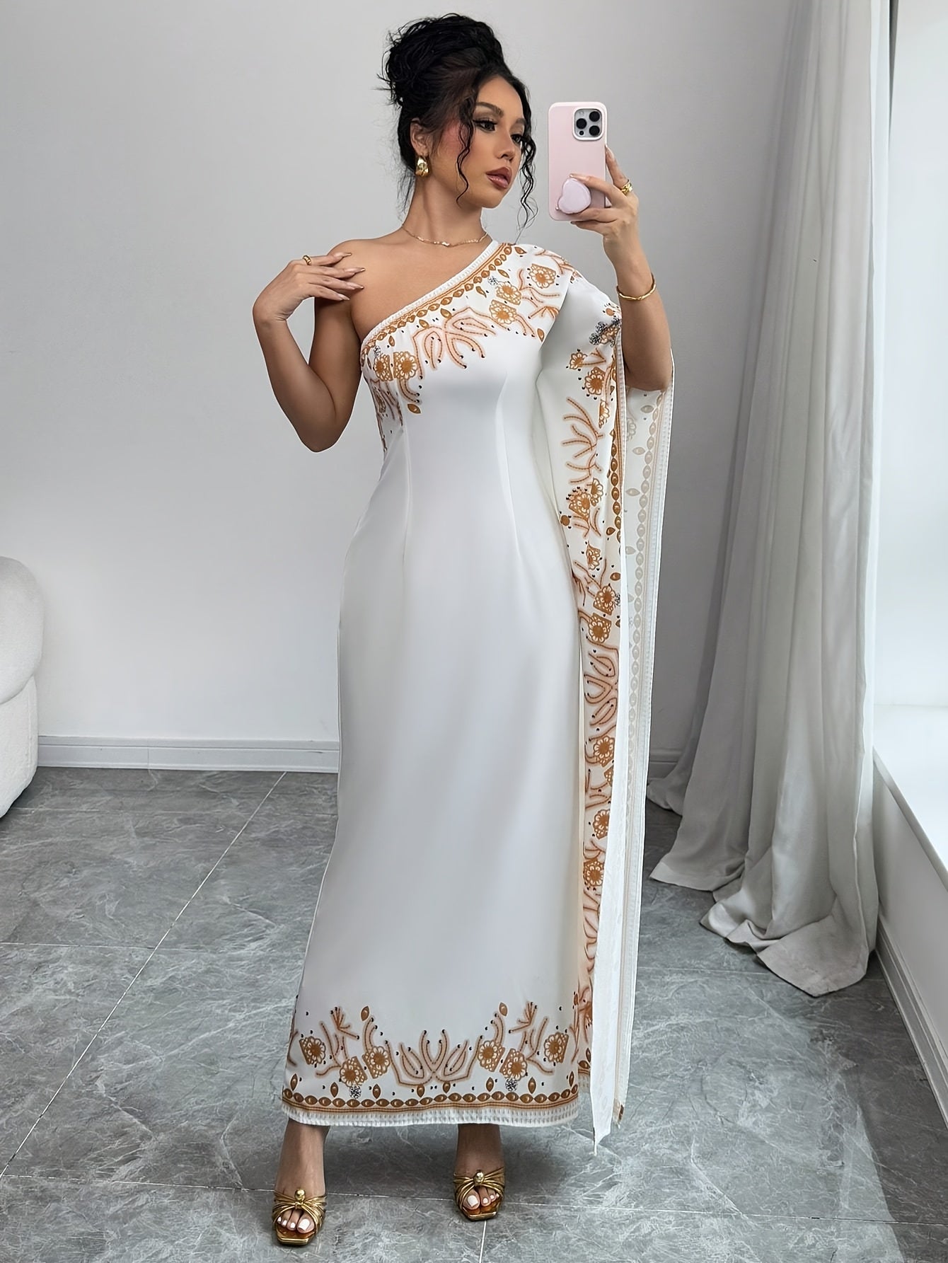 An Elegant Long Dress with an Asymmetrical Floral Print on The Shoulder, Suitable for Formal Occasions.