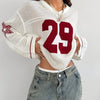 A Oversized Knitted Sweater with Striped And Number Prints, Featuring Long Sleeves.