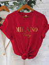 C571 Exuding elegance and modern luxury the design features MILANO in bold shimmering Golden uppercase letters with ITALY elegantly scripted in a smaller lighter font directly beneath all set against a deep black background T