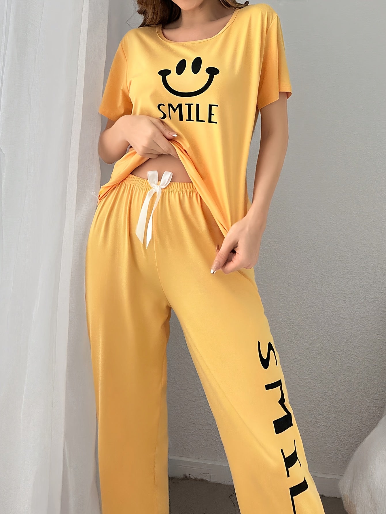 Women's Smiling Face & Letter Print Casual Pajama Set, Short Sleeve Round Neck Top & Pants, Comfortable Relaxed Fit