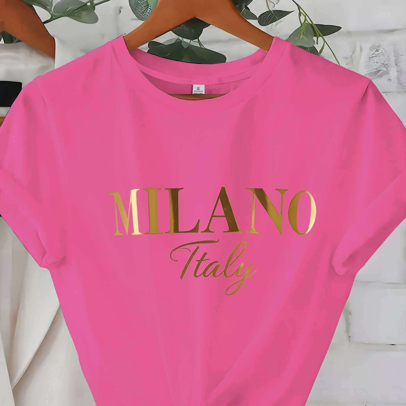 C571 Exuding elegance and modern luxury the design features MILANO in bold shimmering Golden uppercase letters with ITALY elegantly scripted in a smaller lighter font directly beneath all set against a deep black background T