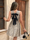 Elegant Floral Midi Dress for Women - Sleeveless Crew Neck with Black Bow Detail, Spring/Summer/Fall Fashion, Floral Print Peplum Dress