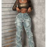 Vintage-style women's water-washed distressed pants with slit at the hem, made of denim fabric.