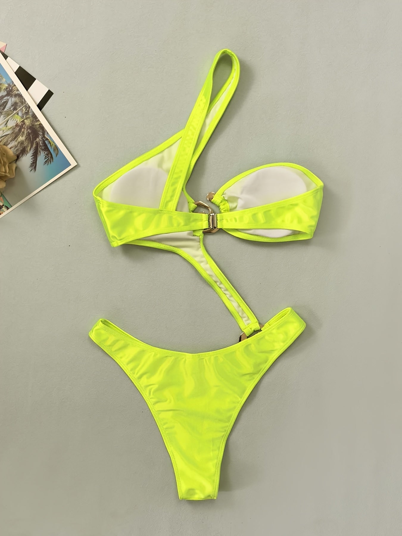 Golden Metallic Ring-Linked One-Piece Swimsuit for Women - Sexy High-Stretch Bikini with Asymmetrical Design, Glossy Finish, and Built-In Bra Pad