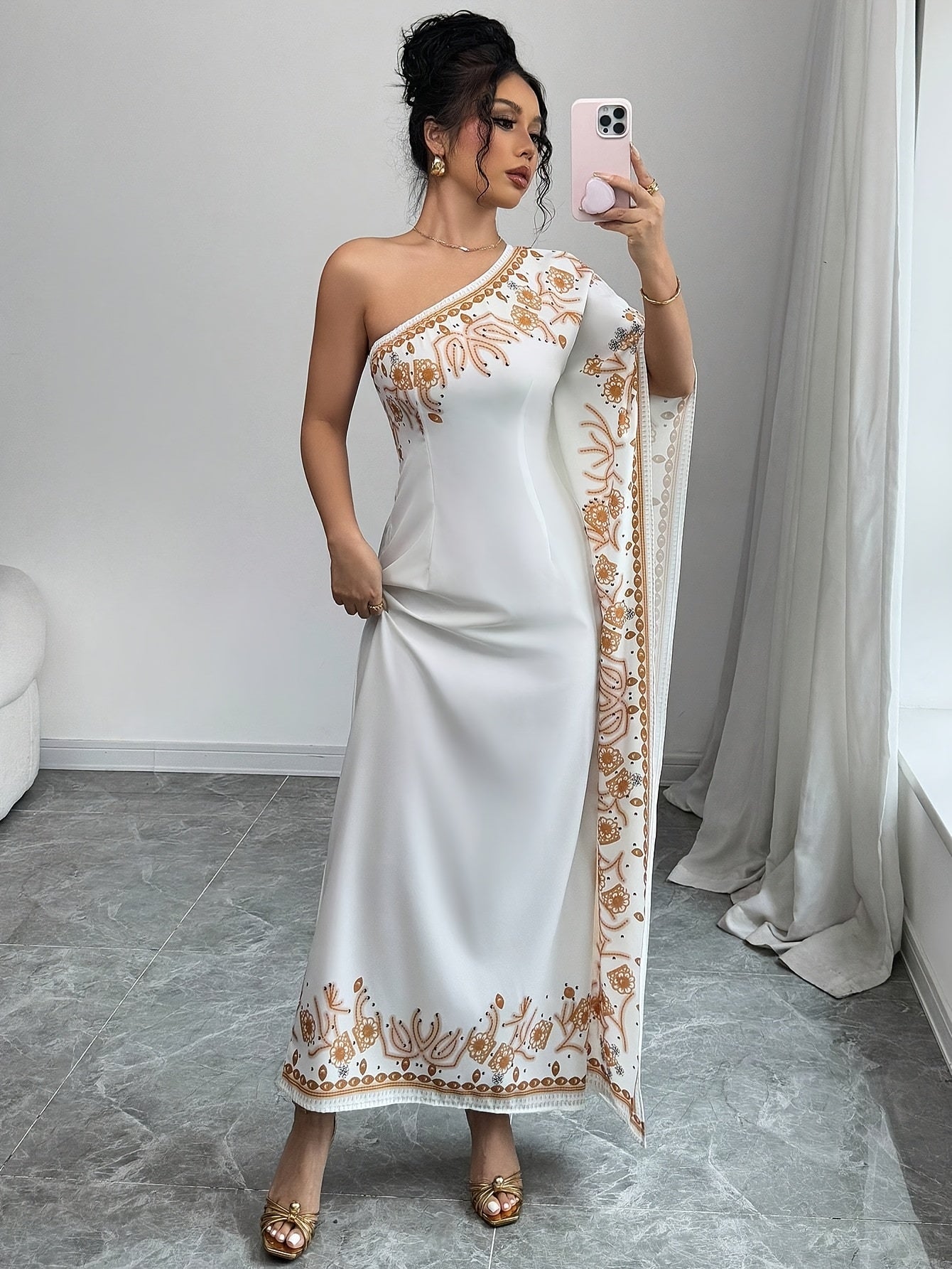 An Elegant Long Dress with an Asymmetrical Floral Print on The Shoulder, Suitable for Formal Occasions.