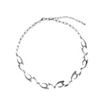 Irregular Shaped Metal Necklace On The Street