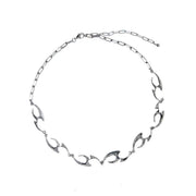 Irregular Shaped Metal Necklace On The Street