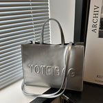 Stylish Black Tote Bag with "TOTE BAG" Embossed Design – Large Capacity Shoulder Handbag for Women, Perfect for Commuting and Casual Outings, Snap Button Closure