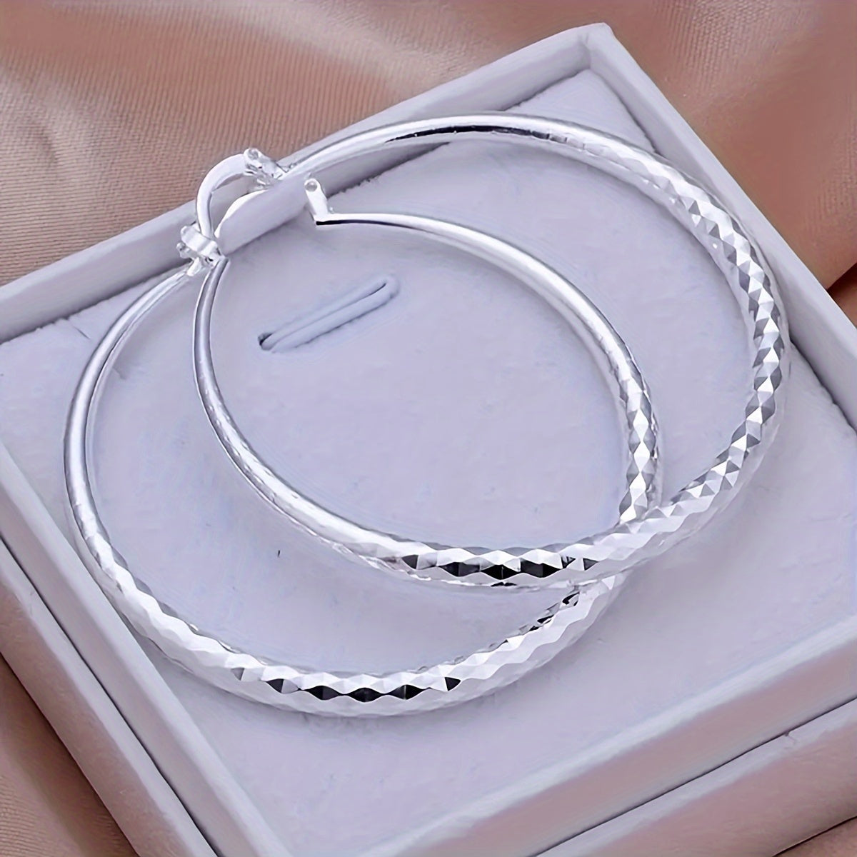 A Pair Of Exquisite Large Circle Earrings, An Elegant Ladies' Accessory In A Luxury Style, Perfect For Women To Wear On A Daily Basis.