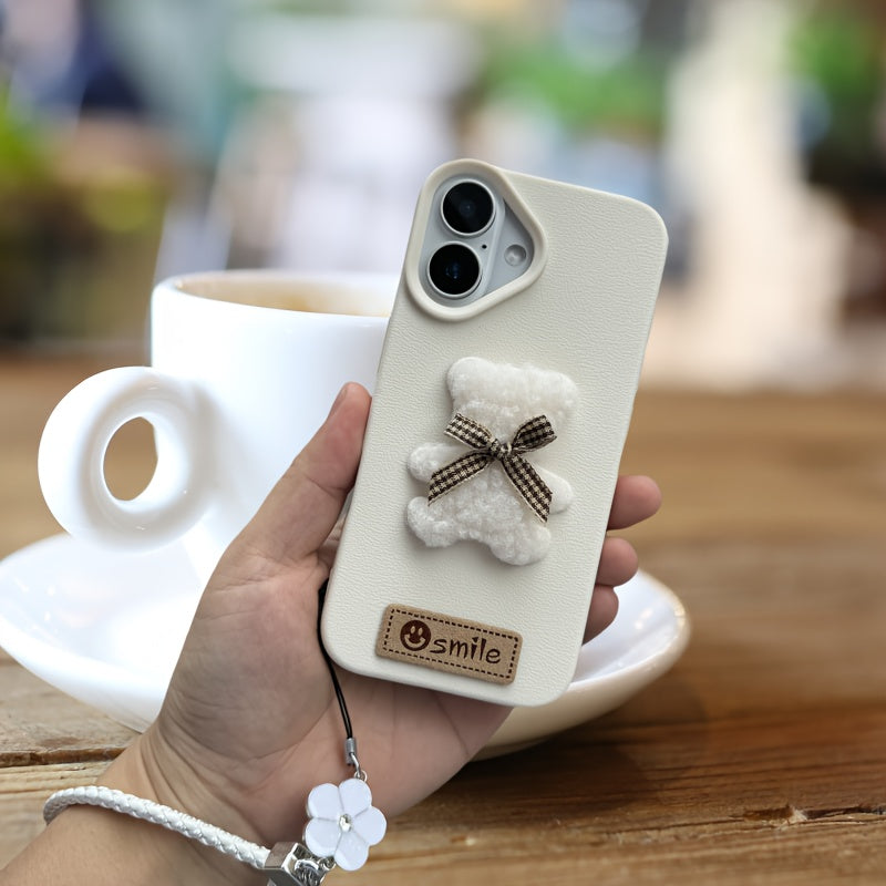 A Single-Pack Plush Teddy Bear Phone Case with a Bow, Available in White And Brown. It Comes with a Wrist Strap And Features a Simple And Elegant Faux Leather Texture That Is Anti-Slip And Fingerprint-Resistant. Made with TPU